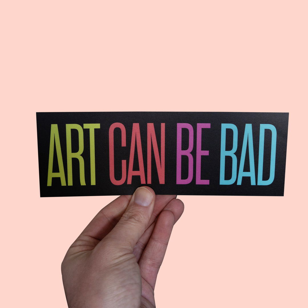 Art Can Be Bad Bumper Sticker held