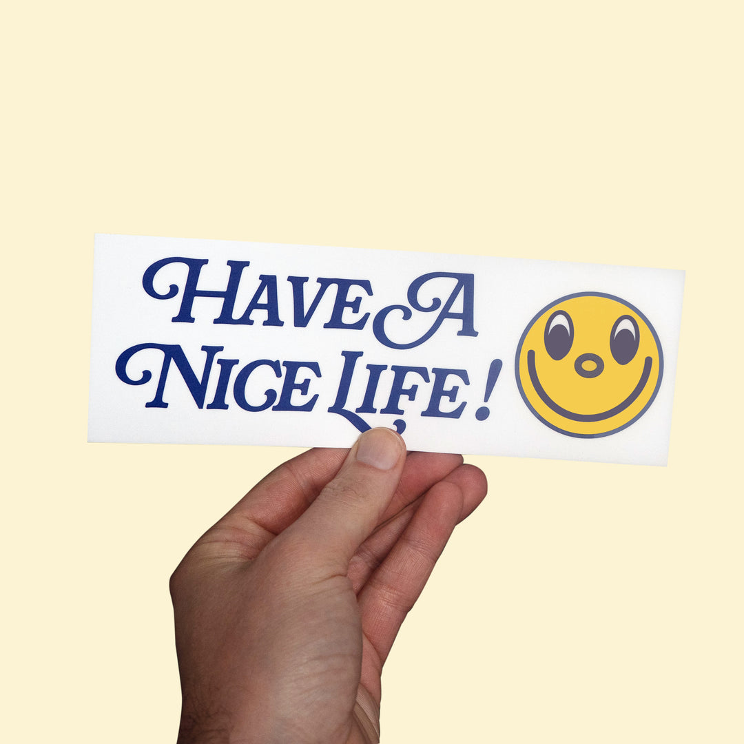 Have a Nice Life Bumper Sticker held